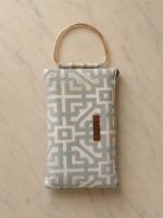 Geometric light patterned prayer bag with gold handle