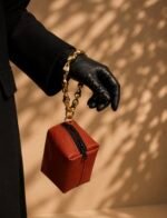Mini burnt orange prayer bag with gold handle