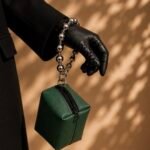 Mini green prayer bag with silver handle