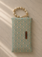 Triangular pattern bag with beaded twisted handle